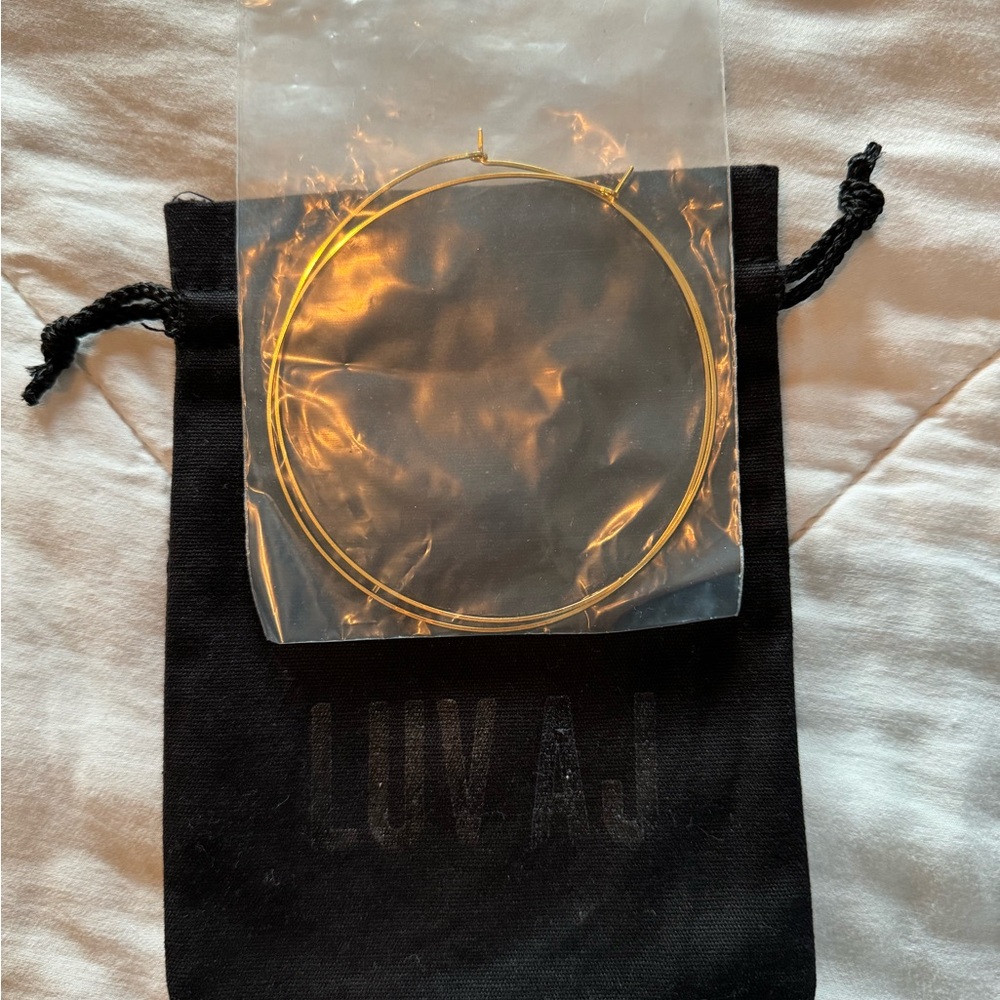 Luv AJ XL gold hoop earrings.